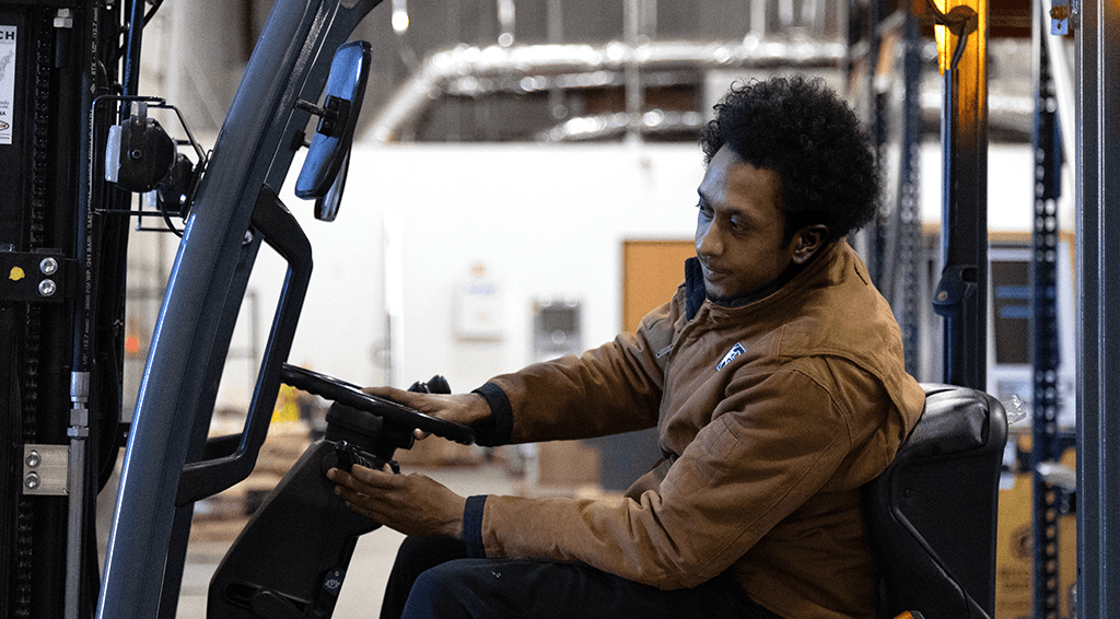 Bibbeo employee operating a forklift
